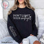 Don't Limit Your Challenges Front or Sleeve Black or White